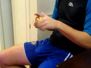 a guy in shorts and a rubik's cube has a boner
